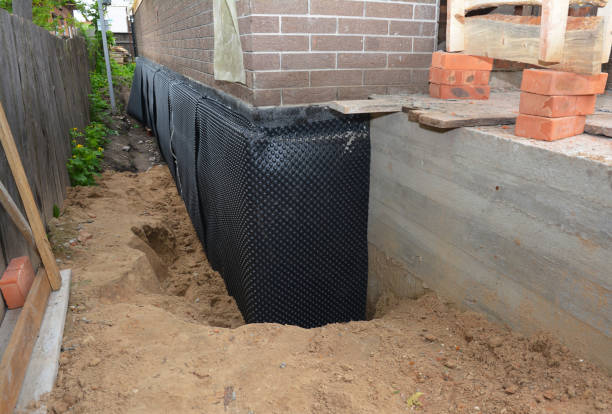 Happy homeowners after waterproofing job in Michigan City